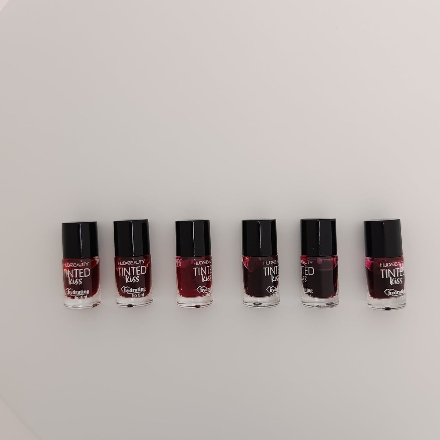 Huda Beauty Tinted Kiss Hydrating Lip Tint – 6 Shades | Long - Lasting, Waterproof & Smudge - Proof - Lotshop.pk