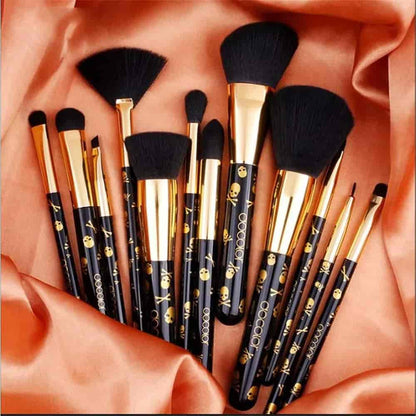 Professional 12-piece face and eye makeup brush collection with decorative gold skull design