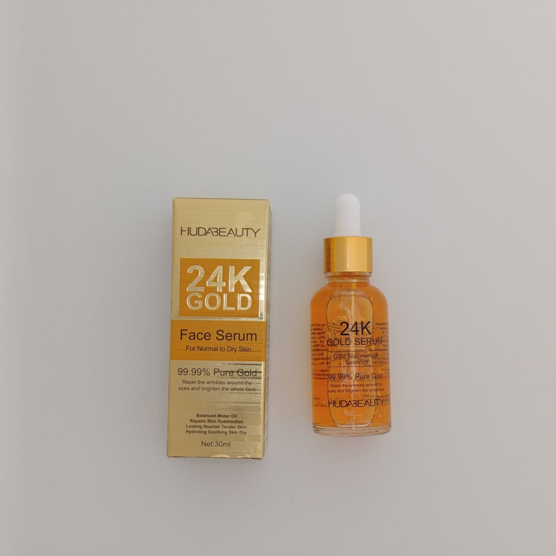 Huda Beauty 24K Gold Face Serum – Pure Gold Anti - Aging & Brightening Serum (30ml) - Lotshop.pk
