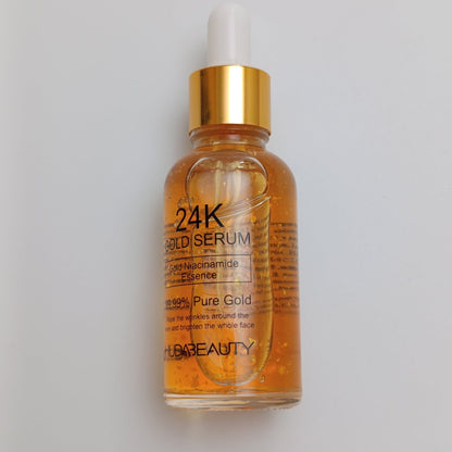Huda Beauty 24K Gold Face Serum – Pure Gold Anti - Aging & Brightening Serum (30ml) - Lotshop.pk