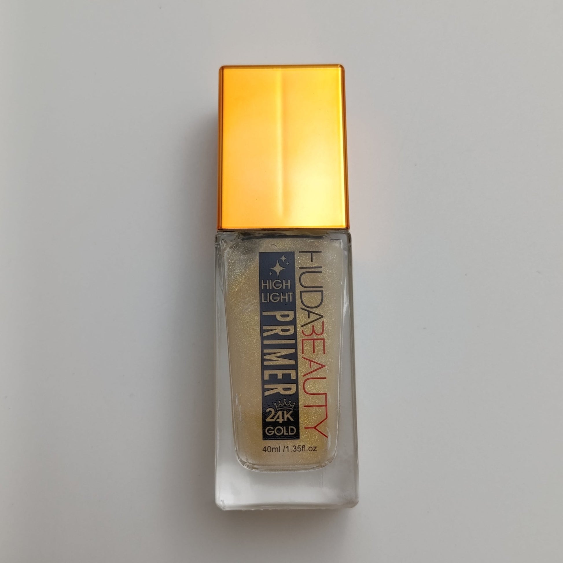 Huda Beauty 24K Gold Highlight Primer – Radiant Glow & Long - Lasting Makeup (40ml) - Lotshop.pk