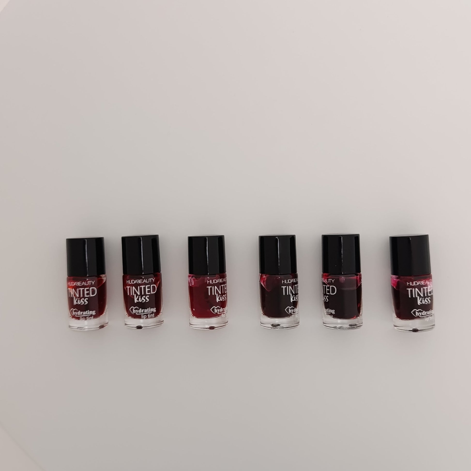 Huda Beauty Tinted Kiss Hydrating Lip Tint – 6 Shades | Long - Lasting, Waterproof & Smudge - Proof - Lotshop.pk