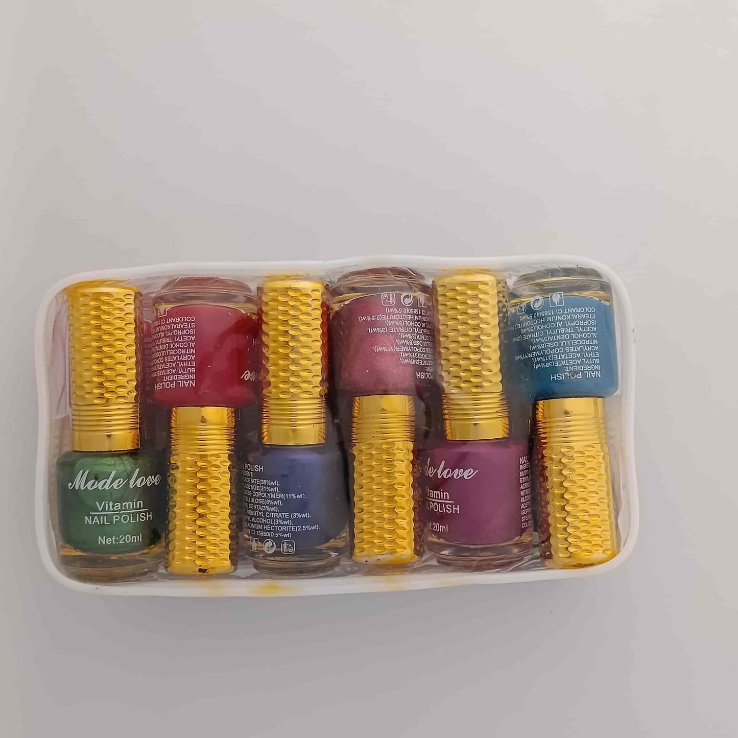 Mode Love 12-Piece Vitamin Nail Polish Set 20ml multi-color shimmer and glossy collection available at Lotshop.pk