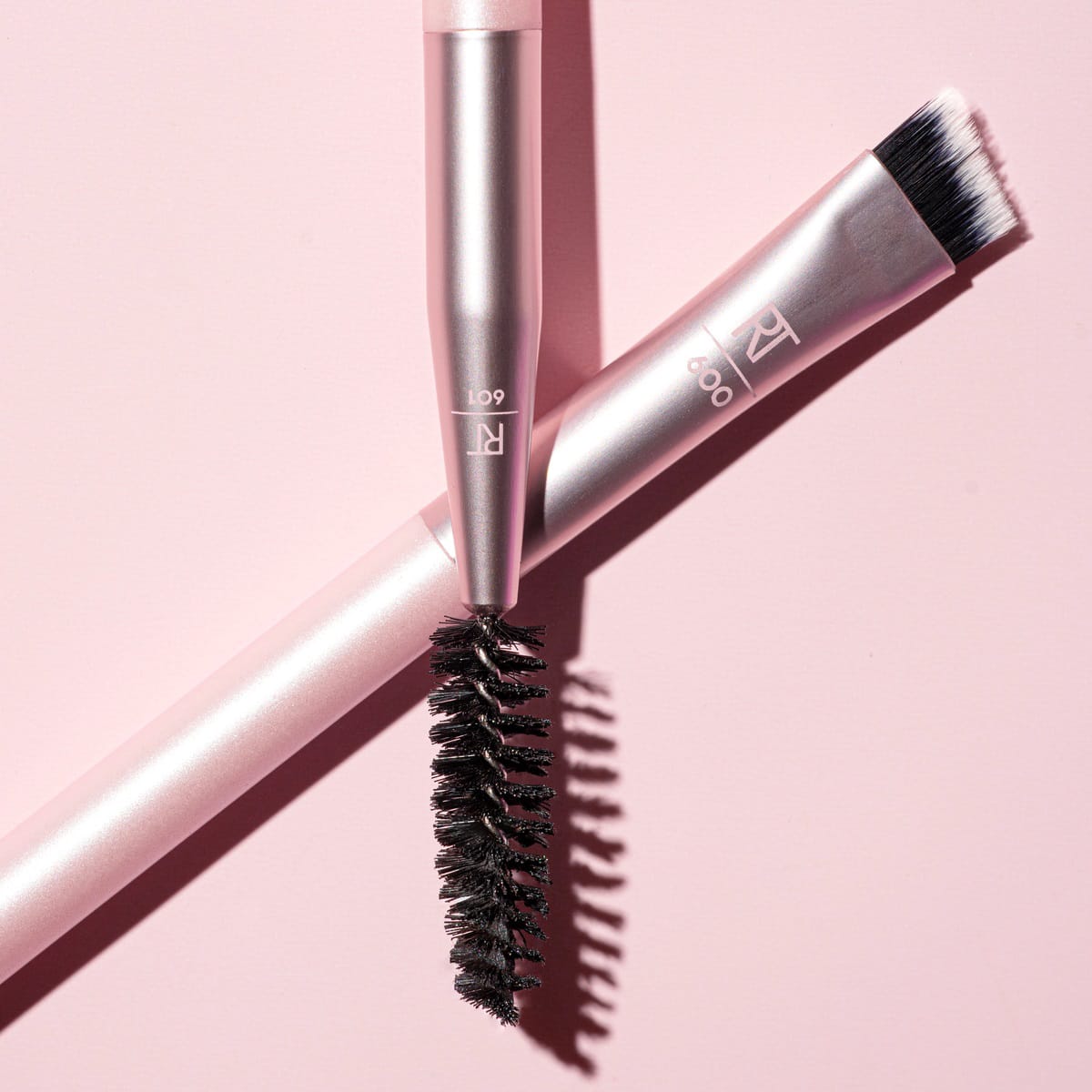 Real Techniques Dual-Ended Brow Brush 600 & 601 with angled eyebrow brush and spoolie available at Lotshop.pk